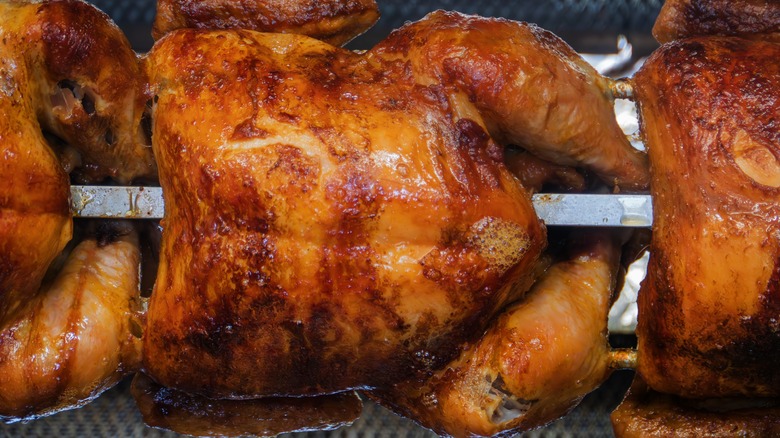 A cooked rotisserie chicken in the oven.