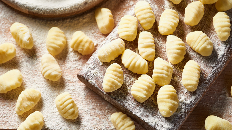 Raw potato gnocchi on a floured board