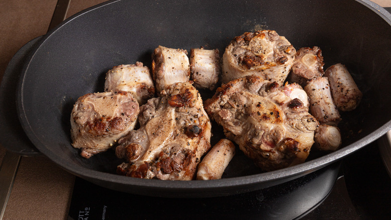 browning oxtails in dutch oven