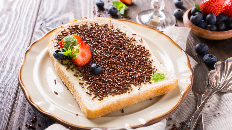 A slice of toast with hagelslag and berries