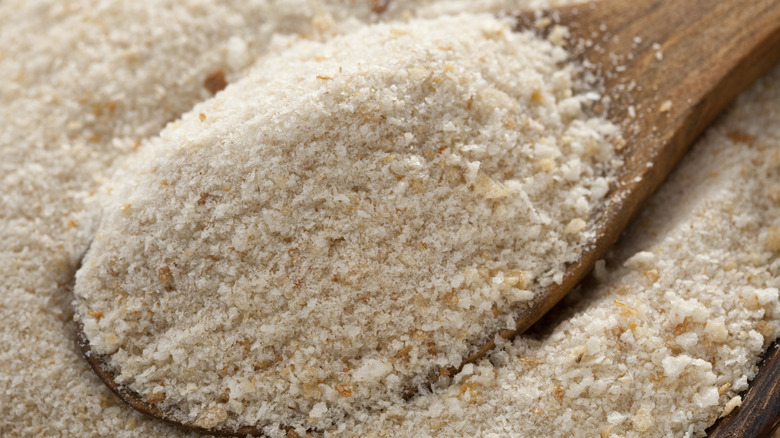 Closeup of breadcrumbs in wooden spoon