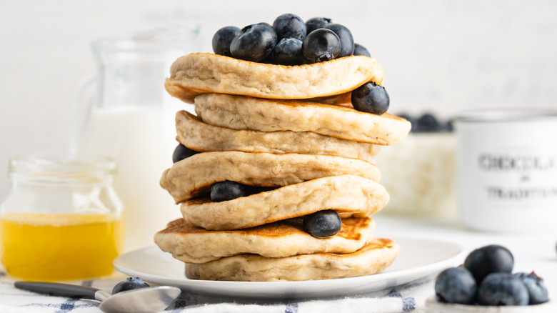 Blueberry pancakes stacked tall