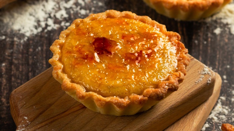 mini pie with brûlée topping on wooden board