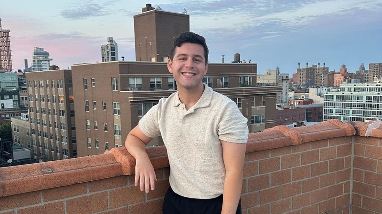 Feber standing on building rooftop