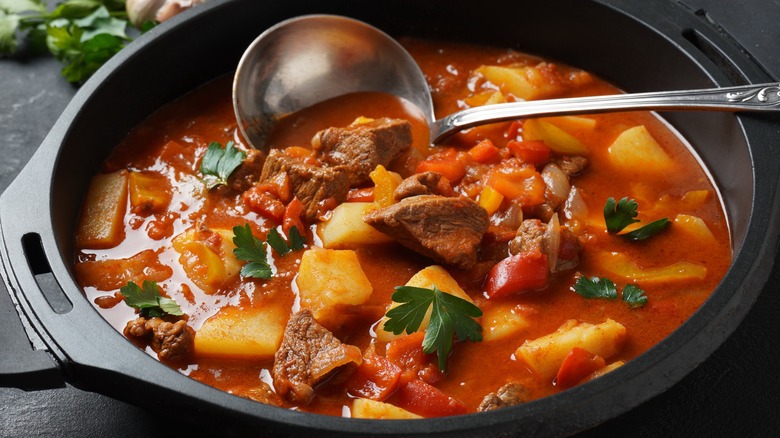 Pot of beef, tomato, bell pepper, and potato soup