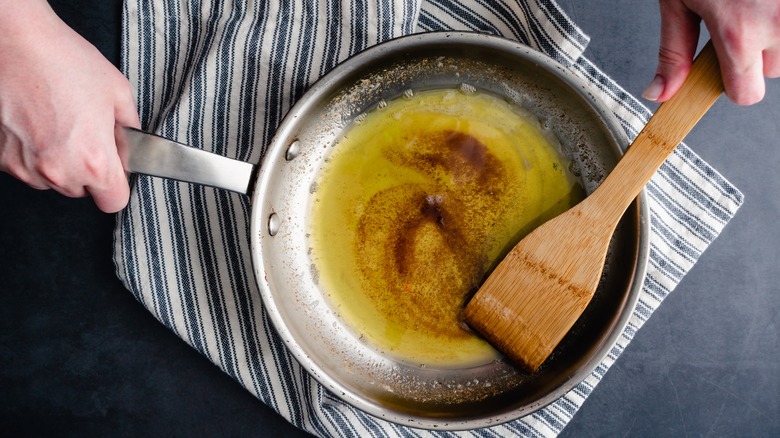 stirring browned butter in pan