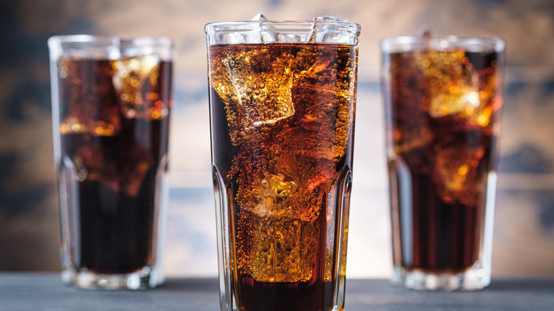 Three cups of cola with ice