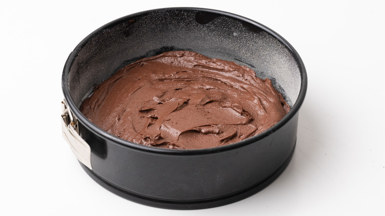 Chocolate cake batter in pan