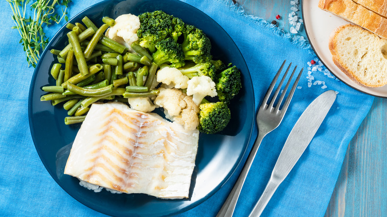 steamed white fish with green vegetables