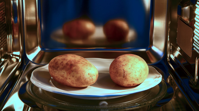 Baked potatoes in a microwave oven