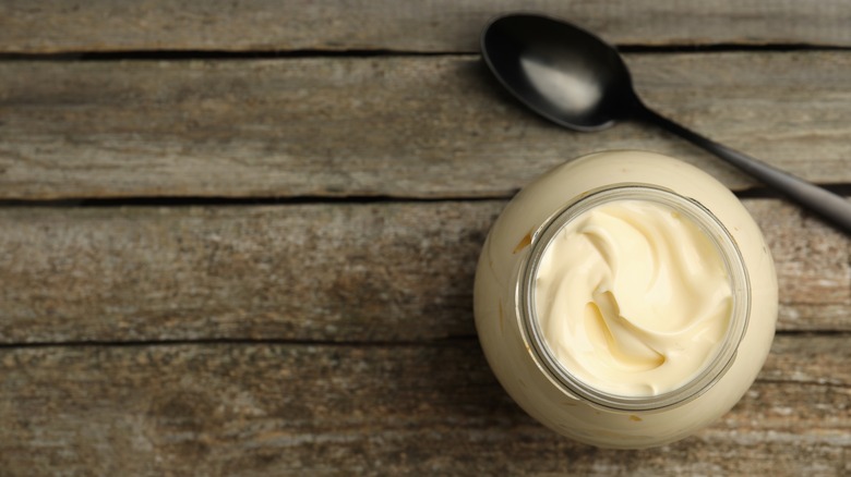 A jar of mayonnaise with a spoon