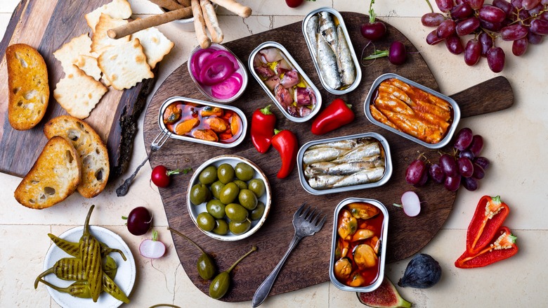 Charcuterie board with tinned fish