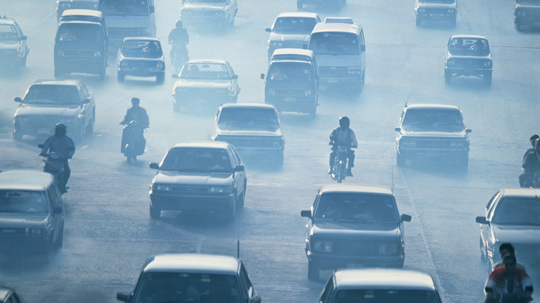 Road filled with cars and exhaust fumes