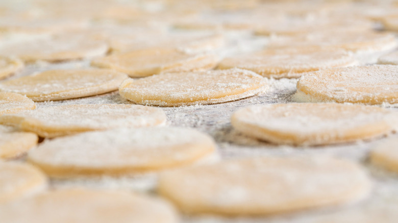 Uncooked cookies sprinkled with flour