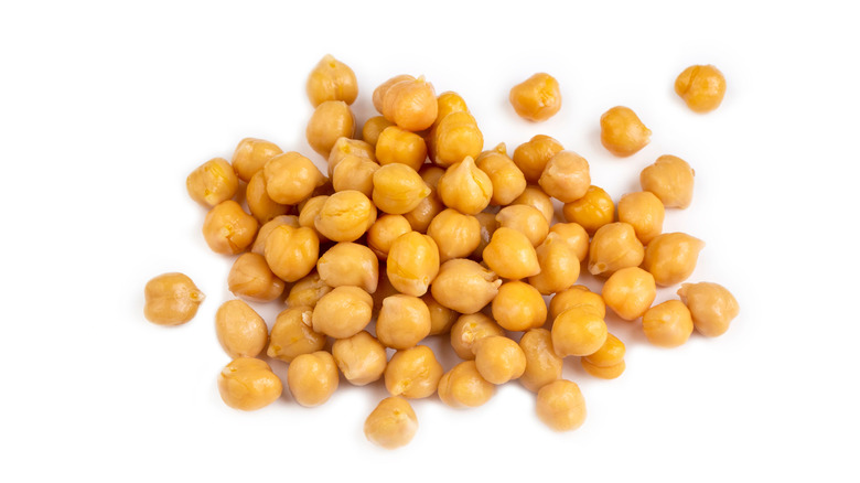 A small pile of strained canned chickpeas.