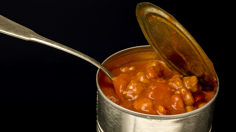 can of chili with spoon