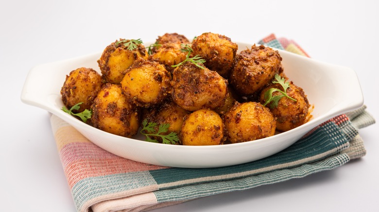 Roasted baby potatoes in white dish