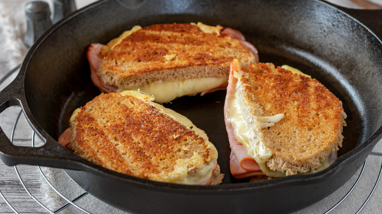Ham and cheese sandwiches in cast iron pan
