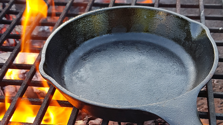 Cast iron skillet over flame
