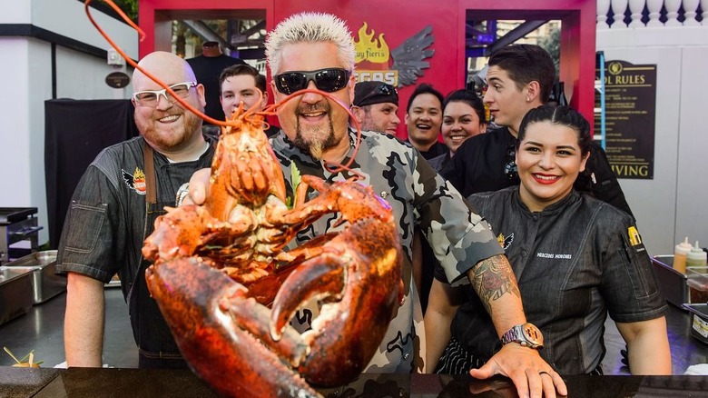 Guy Fieri holding lobster