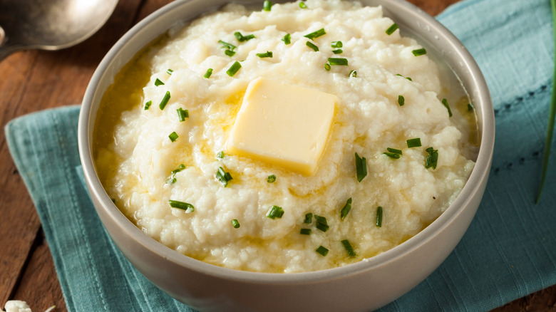 Bowl of mashed potatoes with butter on top