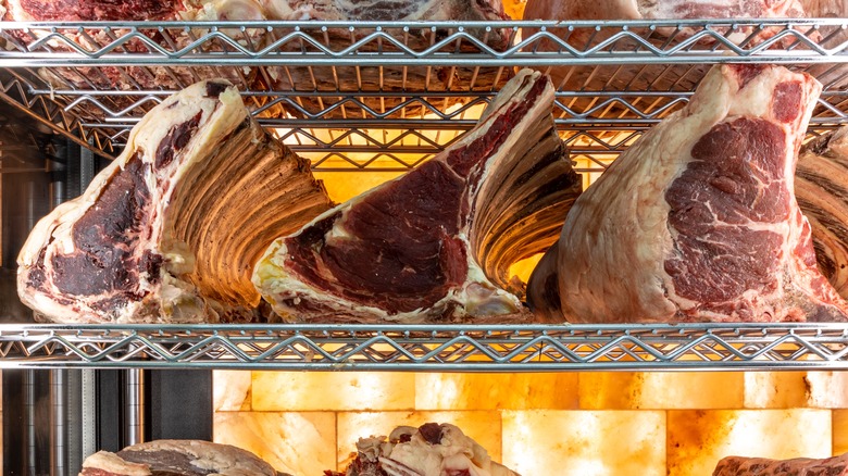 Dry-aged beef sitting on racks