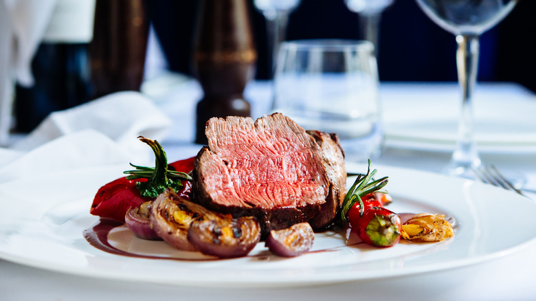 Plated steak on restaurant table