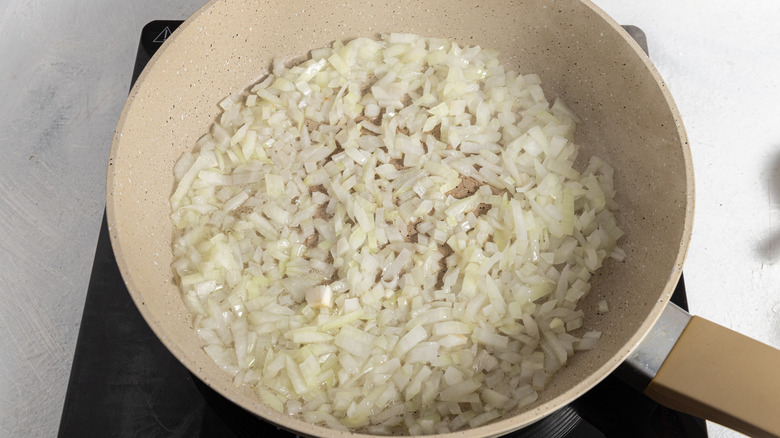 Chopped onion in a skillet.