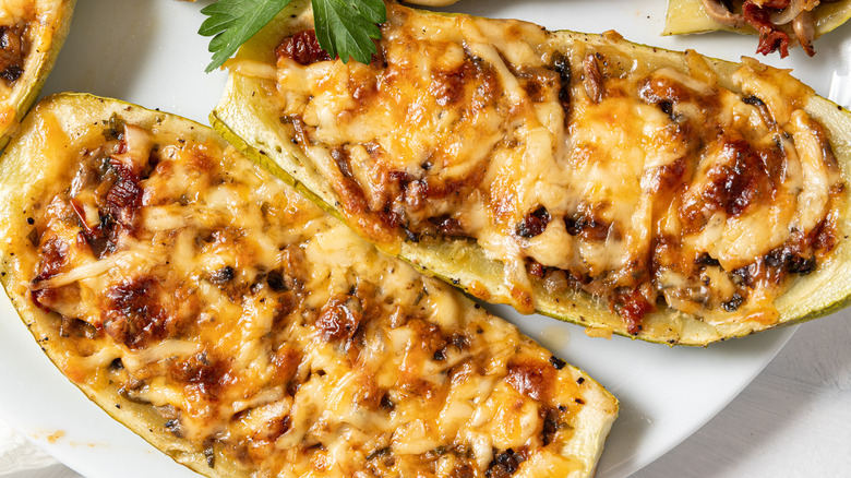 Close up of cheesy mushroom zucchini boats.