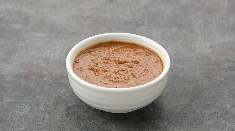 peanut sauce in a small white jar