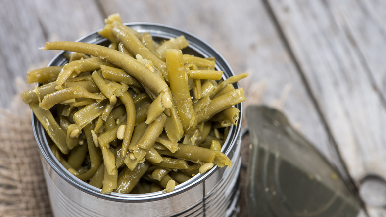 green beans overflowing from can