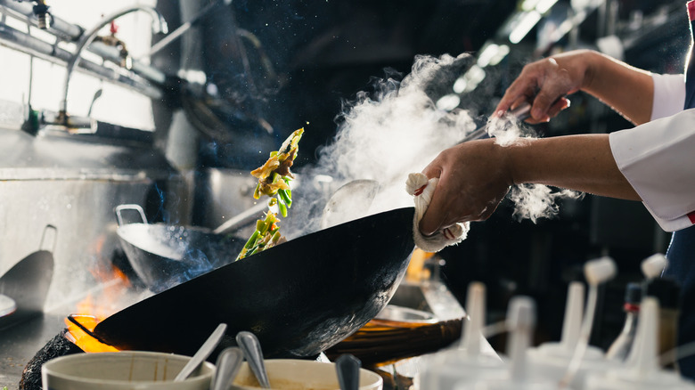 stir fry pan with oil and smoke