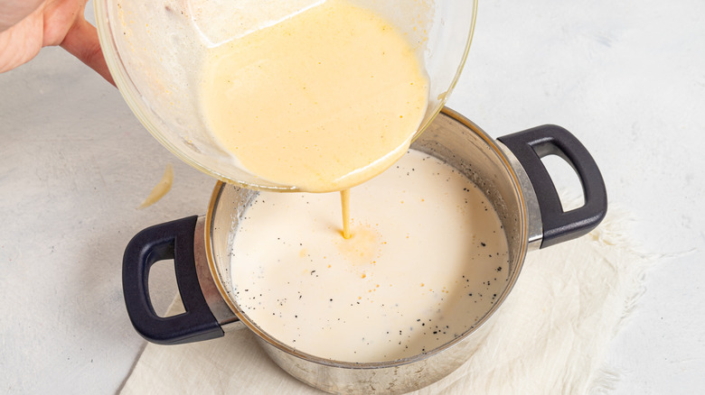 pouring mixture into saucepan