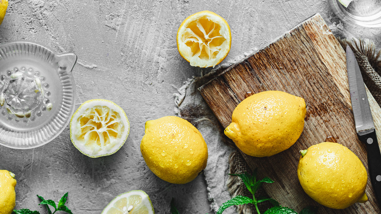 ripe lemons on a cutting board 