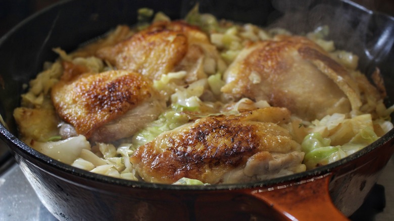 pan of cooking cabbage and chicken