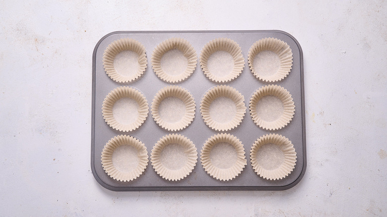 muffin tin filled with liners