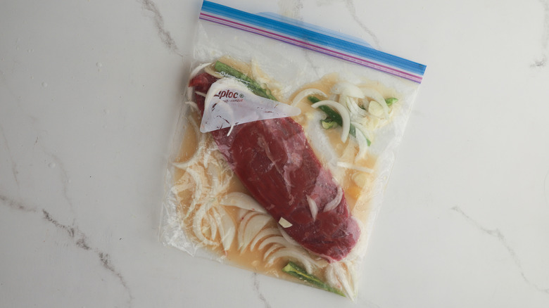 Meat marinating in bag