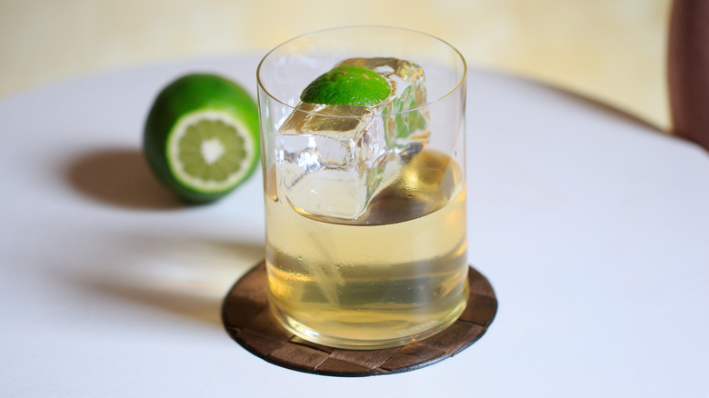 Clarified milk punch with lime on table