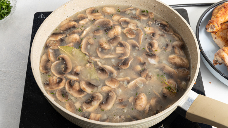 mushrooms and liquid in pan