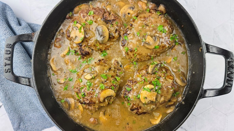 salisbury steak with mushroom gravy in skillet