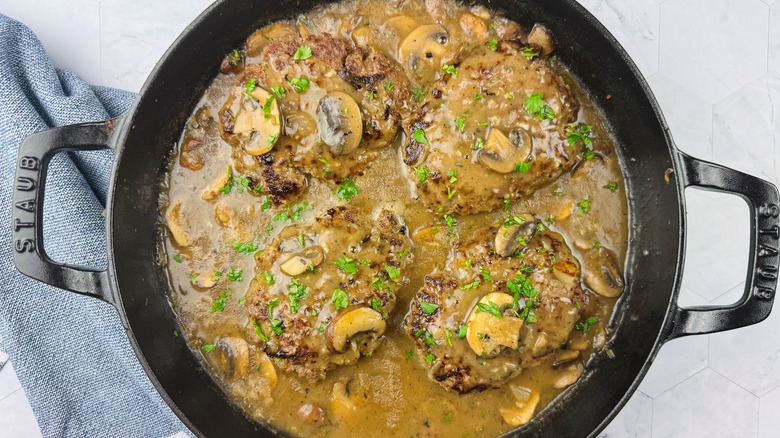 salisbury steak with mushroom gravy in skillet