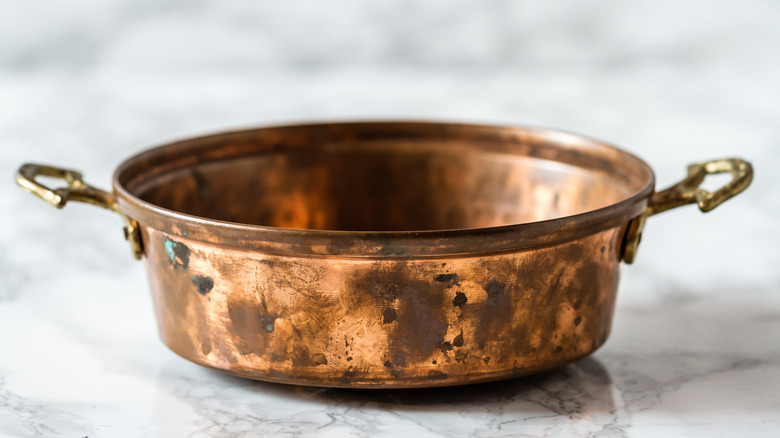 Tarnished copper saucepan