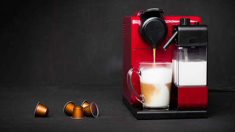 A Nespresso machine brewing coffee