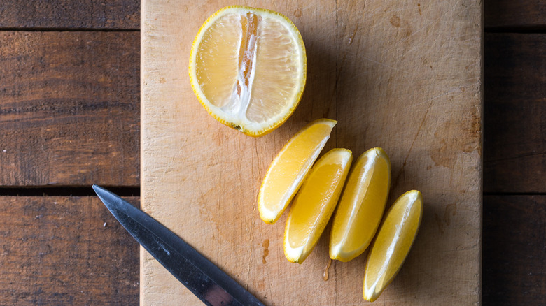 cut lemons on chopping board