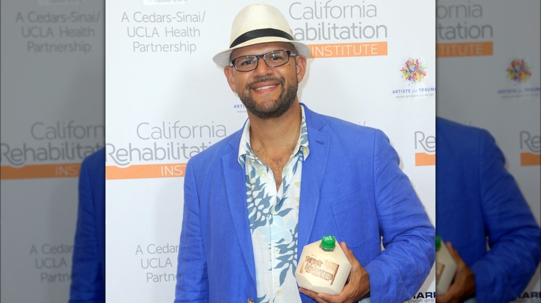 CocoTaps owner Vincent Zaldivar poses with coconut