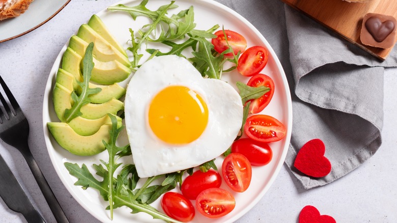 Heart shaped egg with avocado