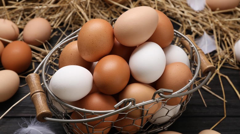 Mixed eggs in metal basket