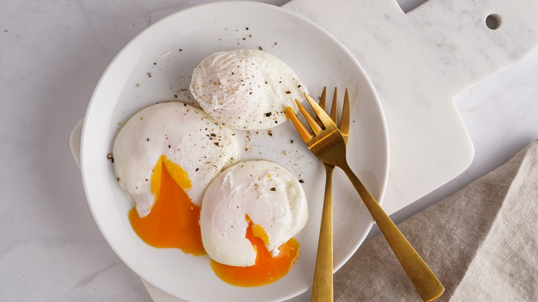 Three poached eggs on a plate