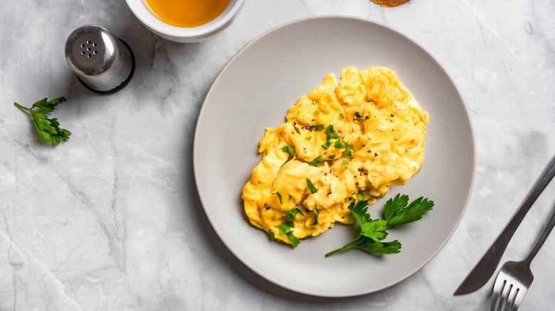 Scrambled eggs in white plate