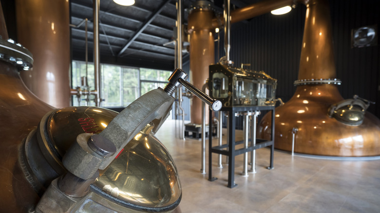 Inside a Japanese whisky distillery full of production equipment